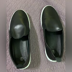 New- Never worn! Women’s Size 6 Slip on Shoes Black with white bottoms.